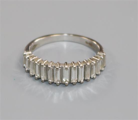 A modern 18ct white gold and baguette cut diamond half hoop ring, size K.